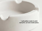 A close-up view of a white ceramic ashtray, with text overlaid on the image providing instructions for creating a pattern.
