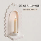 a white candle holder with a lit candle inside, set against a plain white background.