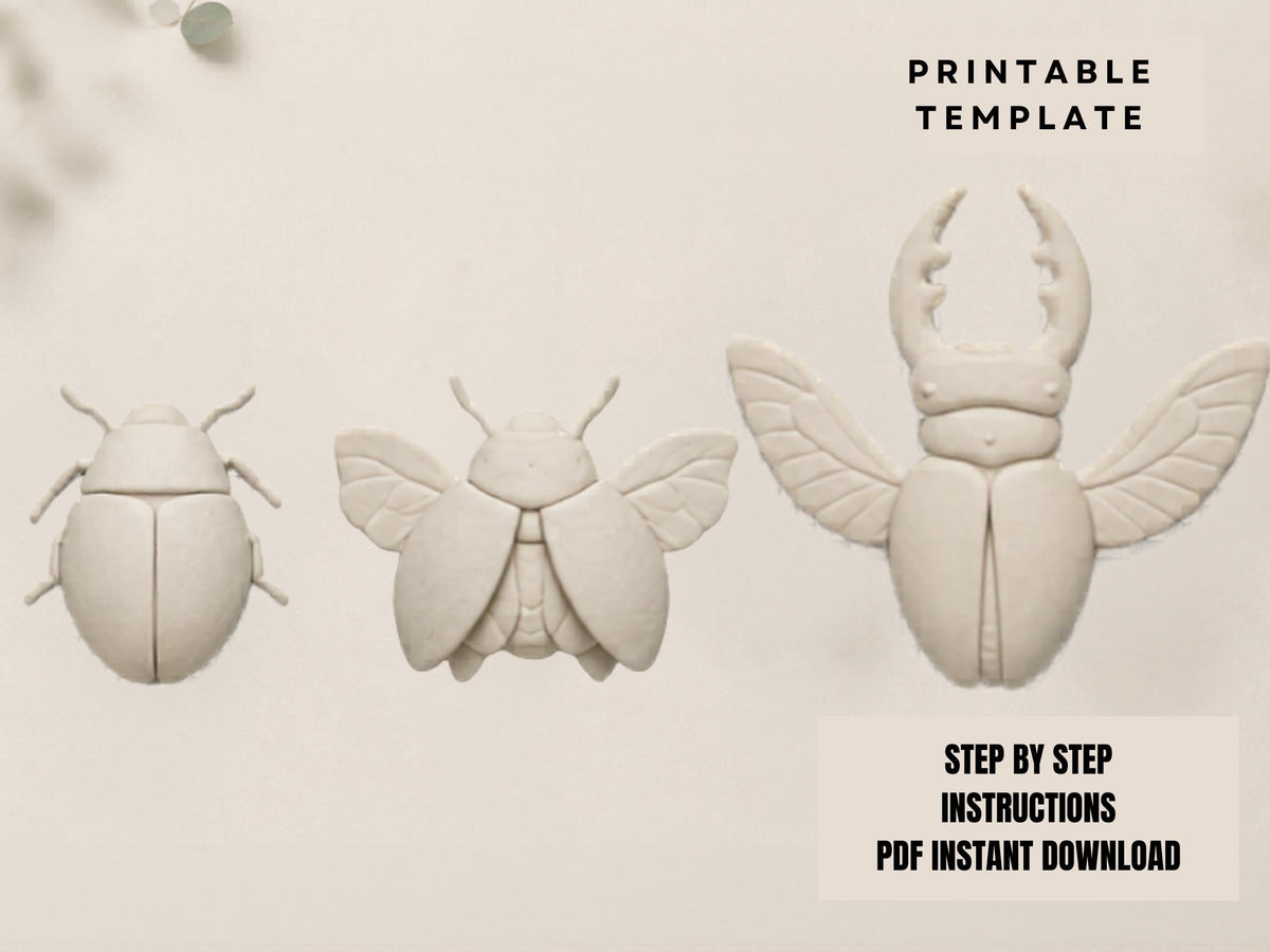 three white sculptures of insects, including a large beetle, a smaller fly, and a ladybug, arranged in a row.