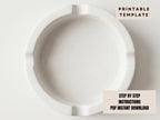 The image is a plain white ashtray with no visible text or objects.