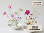 two white bowls filled with colorful flowers, including pink and purple flowers, placed on a white background.