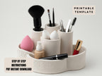 A white ceramic makeup organizer with various makeup brushes and products arranged in it.