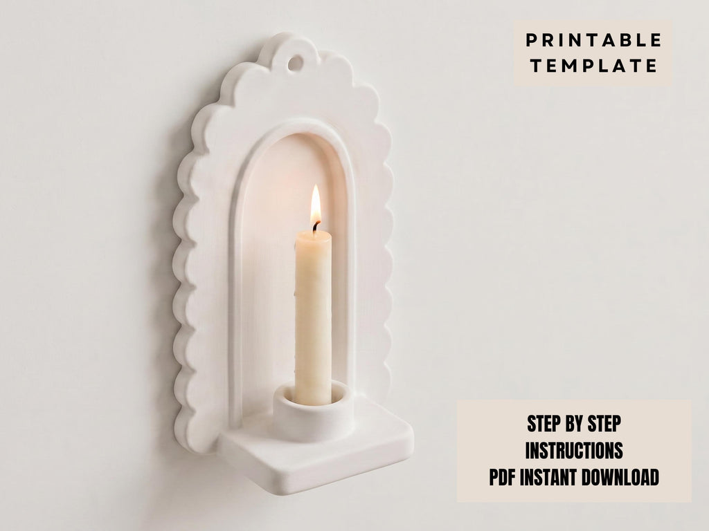 a white candle holder with a lit candle inside, mounted on a wall.