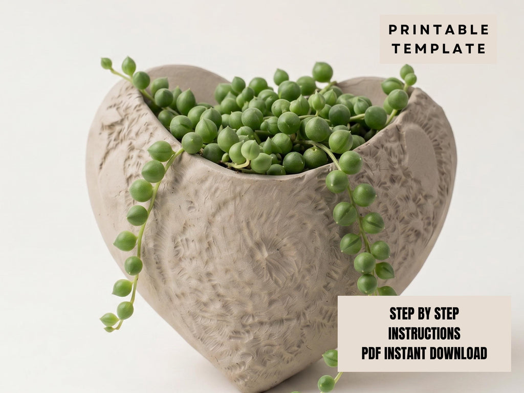 A heart-shaped ceramic planter filled with green pearls or beads, creating a decorative and natural-looking arrangement.