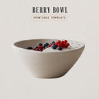A white ceramic bowl filled with fresh berries, including blueberries and red berries, sits on a plain background.