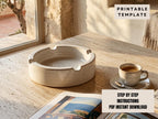 a white ceramic ashtray on a wooden table, with a cup of coffee and a magazine nearby.