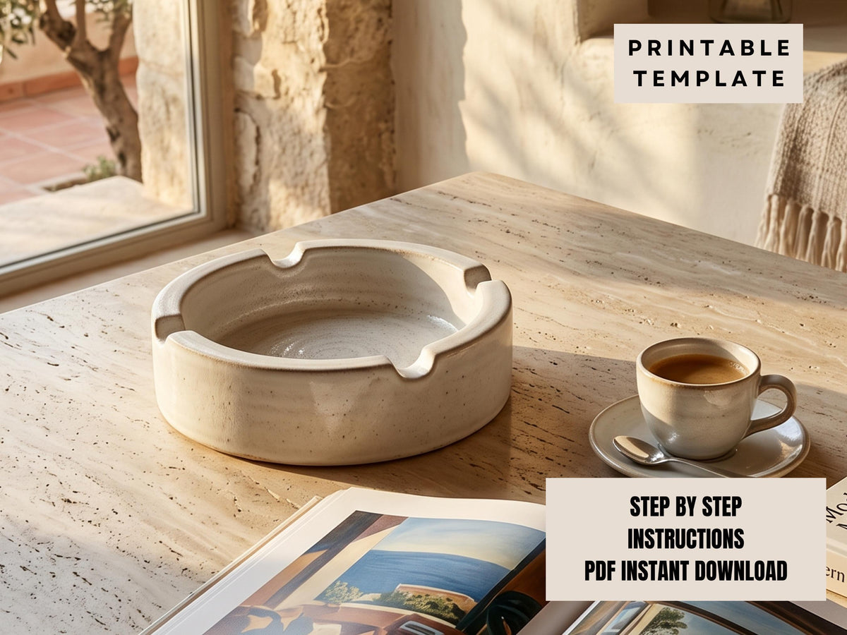 a white ceramic ashtray on a wooden table, with a cup of coffee and a magazine nearby.