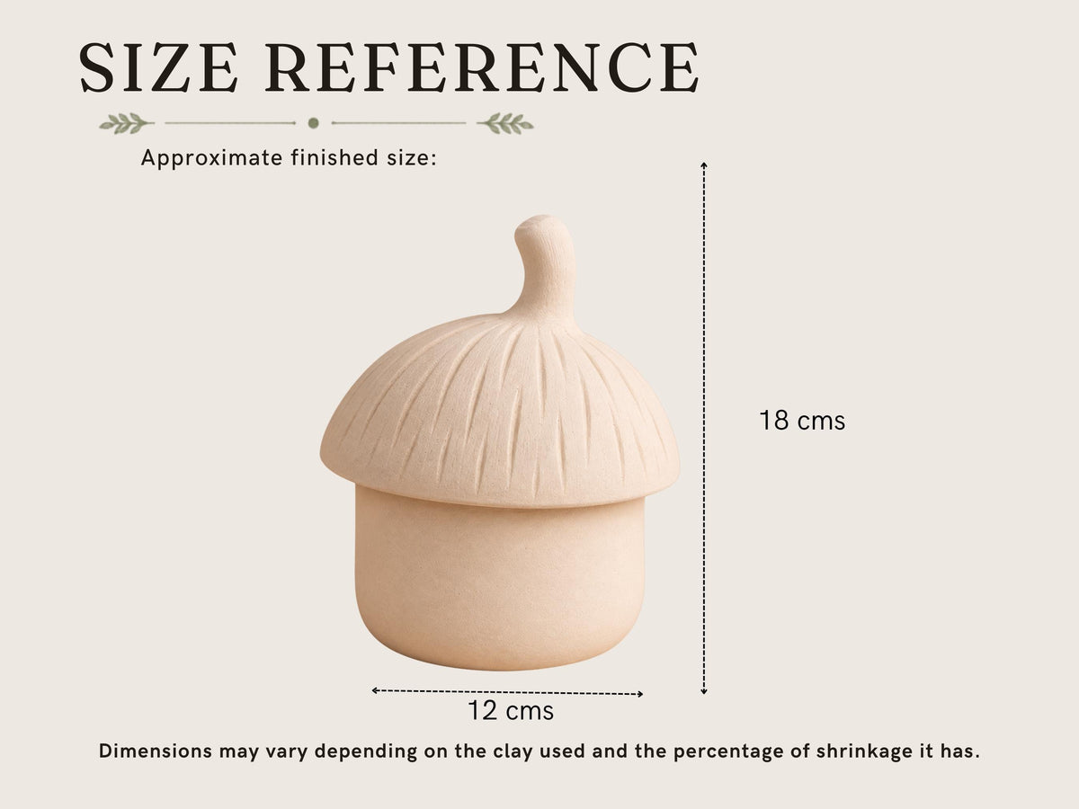 a ceramic object, possibly a bowl or a container, with dimensions provided in centimeters. The object appears to be a small, light-colored ceramic item with a pointed top. The image does not contain any text or additional objects, and the dimensions are consistent with the clay used and the percentage of shrinkage it has.