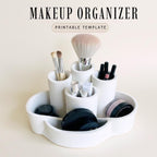 a makeup organizer with various makeup brushes and containers, including a makeup brush, a makeup brush, and a makeup brush, all placed in a white, round, and white-colored container.