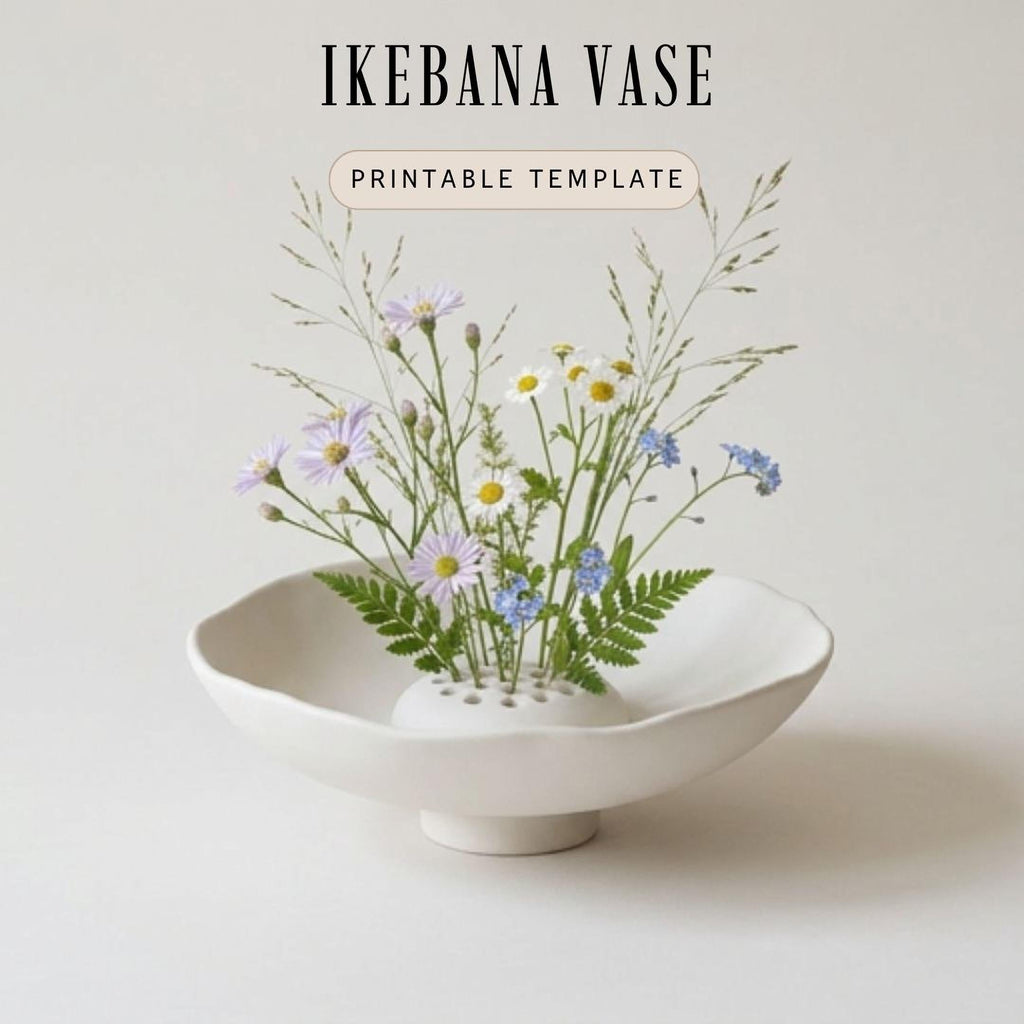 A white ceramic vase filled with a variety of colorful flowers, including daisies and blue flowers, sits on a white surface.