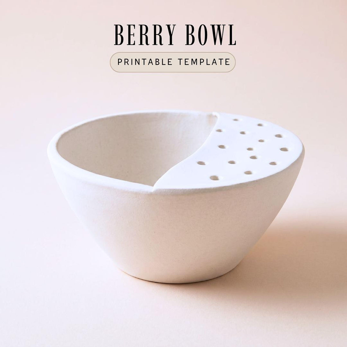 A white ceramic bowl with a hole in the center, sitting on a light pink background.