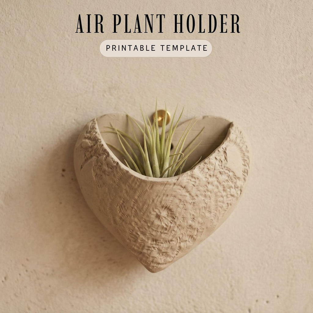 a heart-shaped air plant holder with a plant growing in it, mounted on a wall.