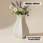 A white vase filled with a variety of colorful flowers, including daisies and lavender, sits on a light-colored surface.