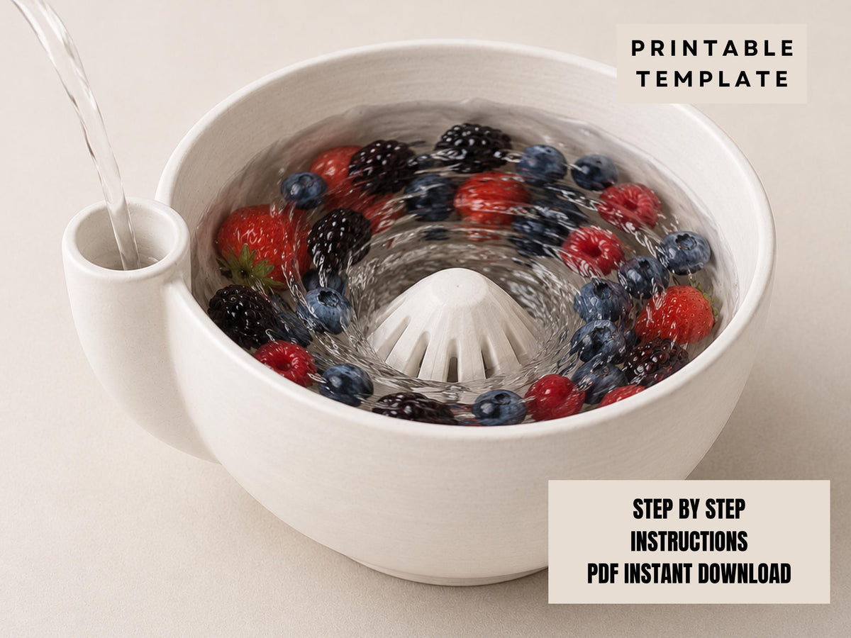 A white bowl filled with a variety of colorful berries, such as strawberries, raspberries, and blueberries, is shown with water being poured into it.