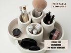 A white makeup organizer with various makeup brushes and containers, including a makeup brush, powder, and other cosmetic items.