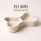 A white, empty pet bowl with a simple, minimalist design.