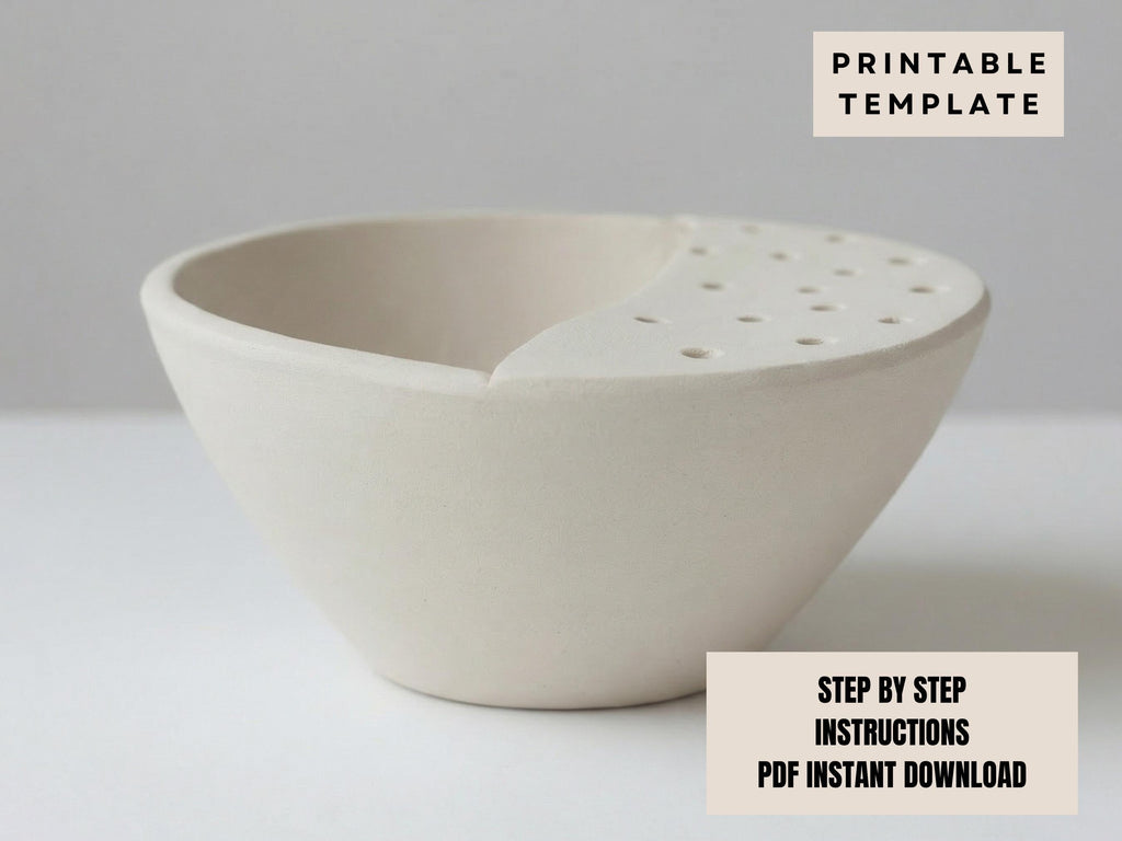 a white ceramic bowl with a hole in the center, sitting on a white surface.